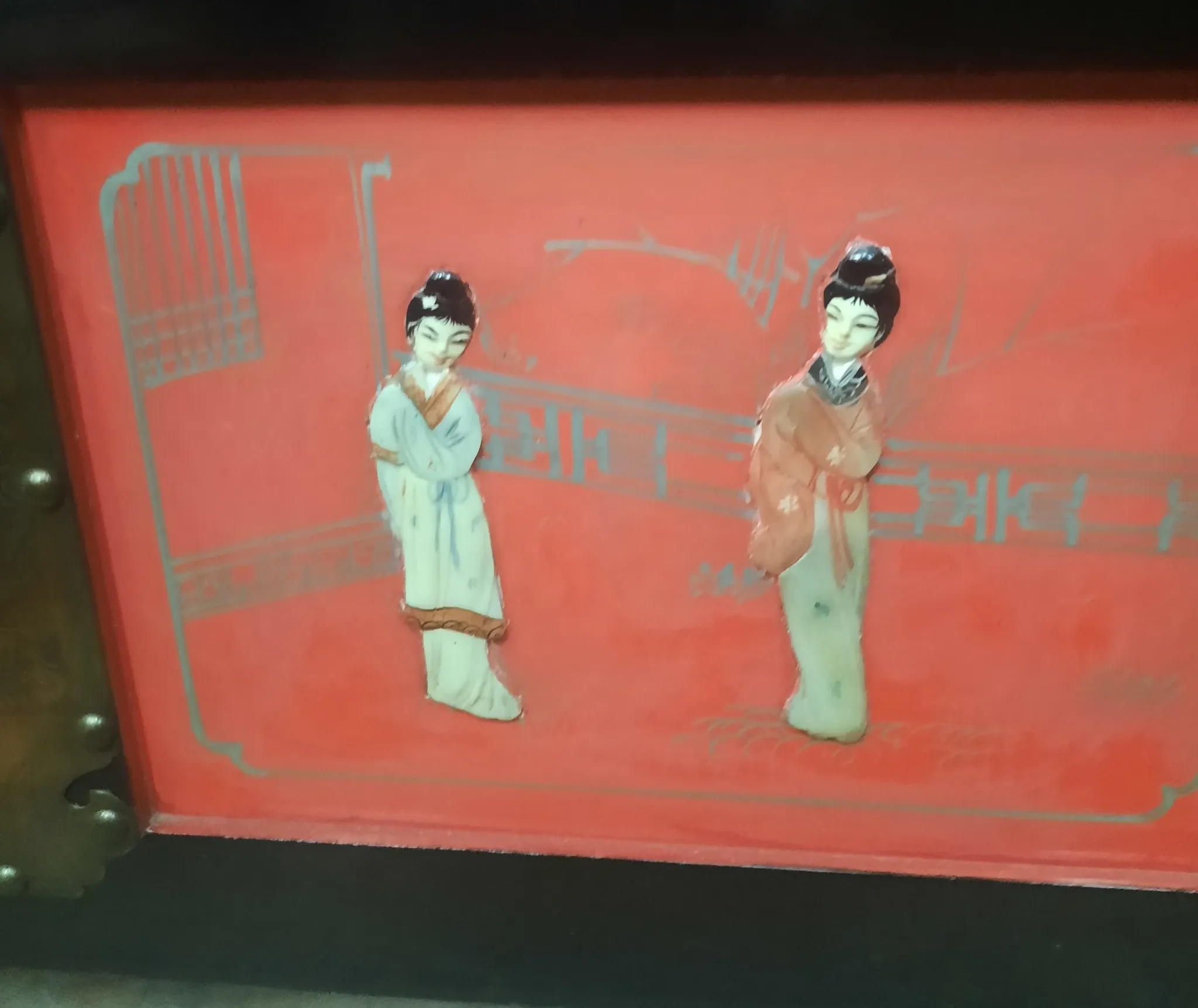 Red lacquered wooden mallet from the Far East.