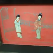 Red lacquered wooden mallet from the Far East.