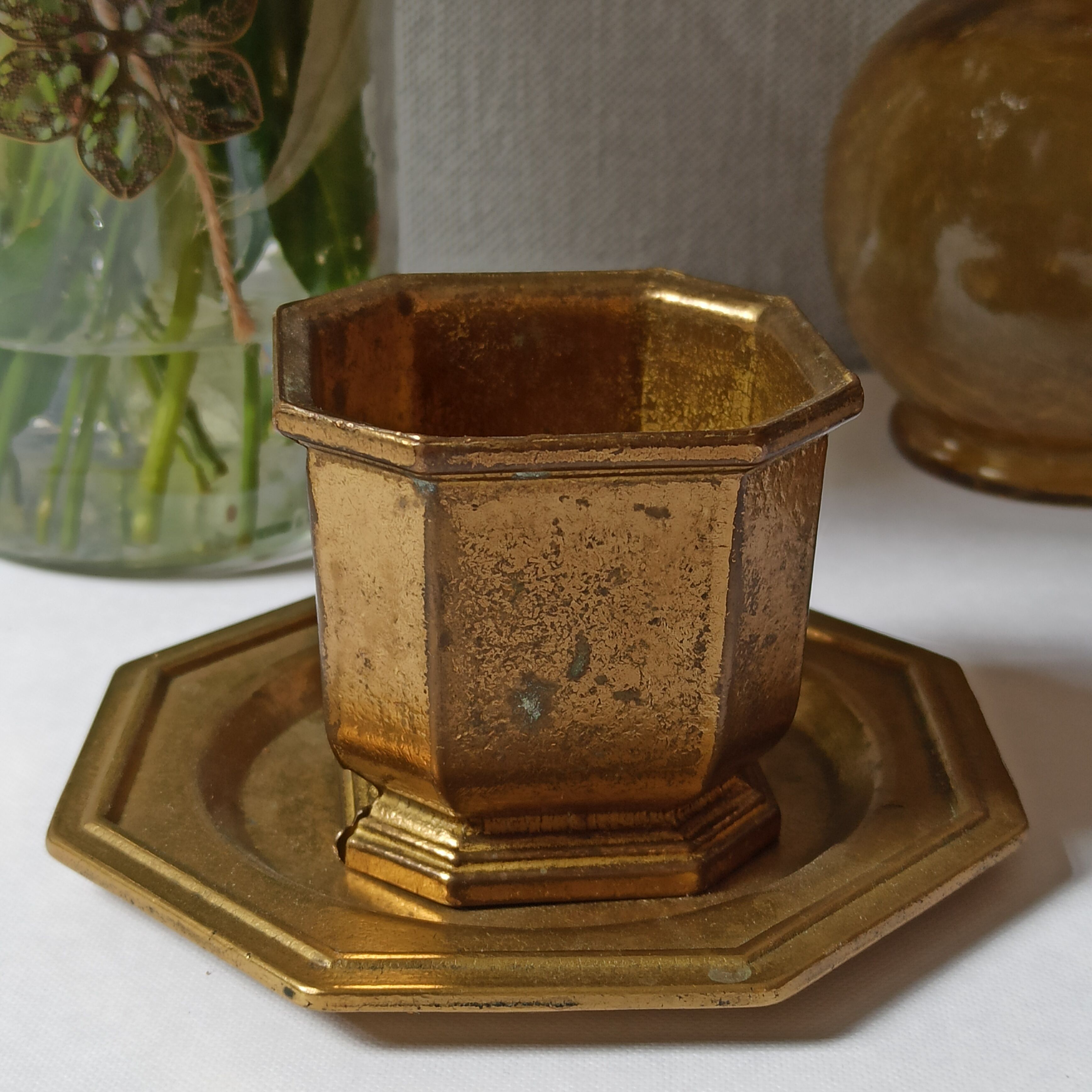 Varnished brass pot on saucer from the 80s