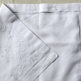 old pillowcase embroidered with fine flowers, marked MP, 19th