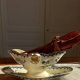 Old gravy boat on frame in terre de fer earthenware by gien, “chardons” model in blue-green