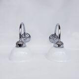 Swan neck and white glass wall lights