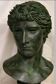 Bust of Greco-Roman Apollo in bronze patina stucco plaster in the antique style.