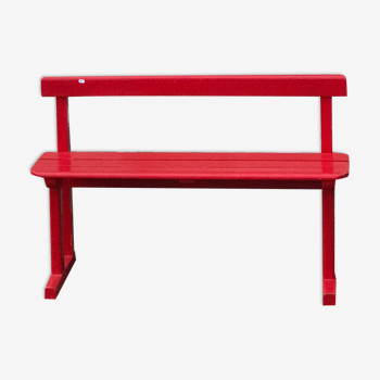 Red old schoolboy bench