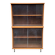 Scandinavian wooden buffet cabinet with sliding glass doors.