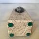 An asymmetrical travertine and fossil bookend.