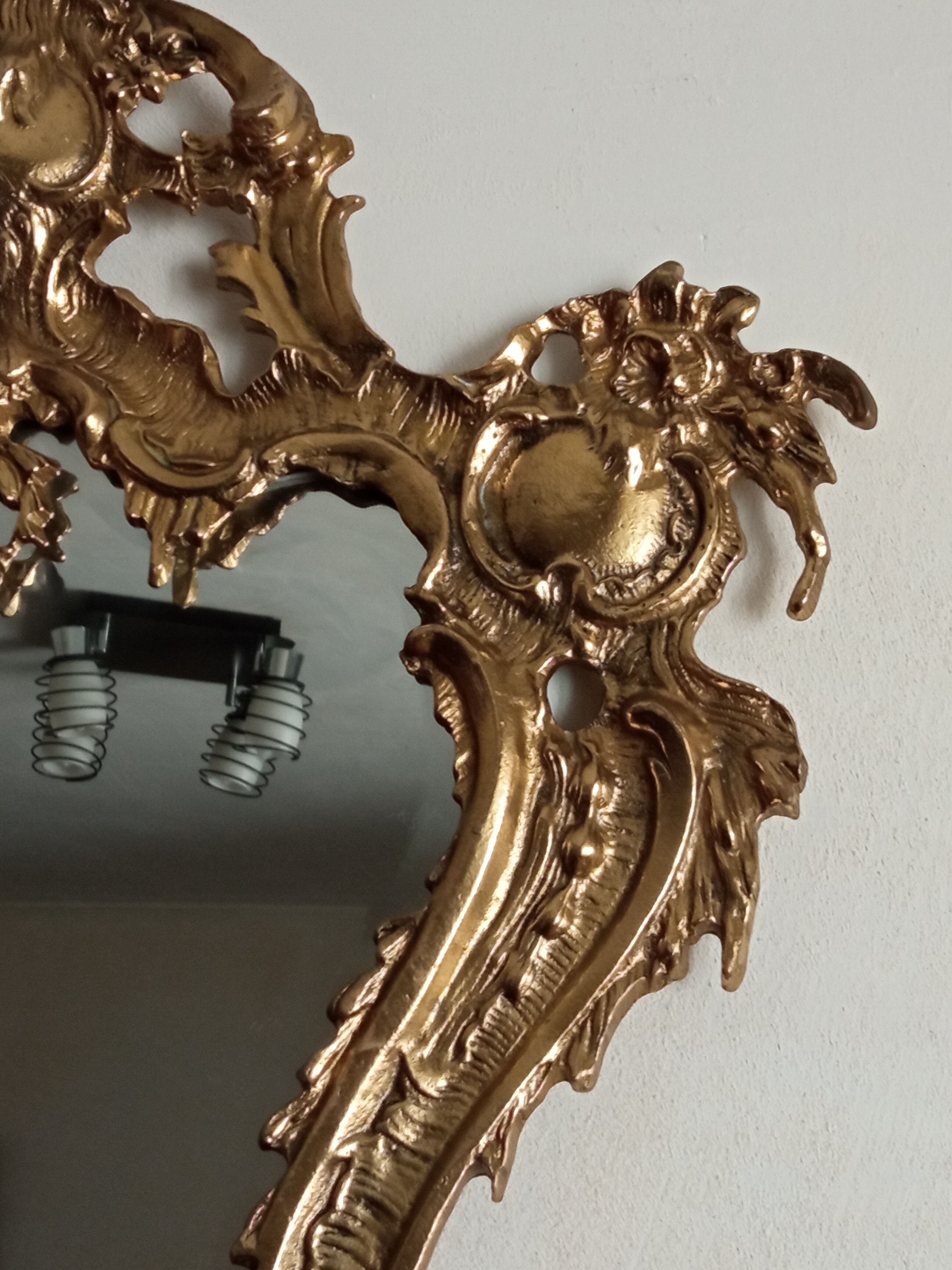 Antique mirror in gilded metal