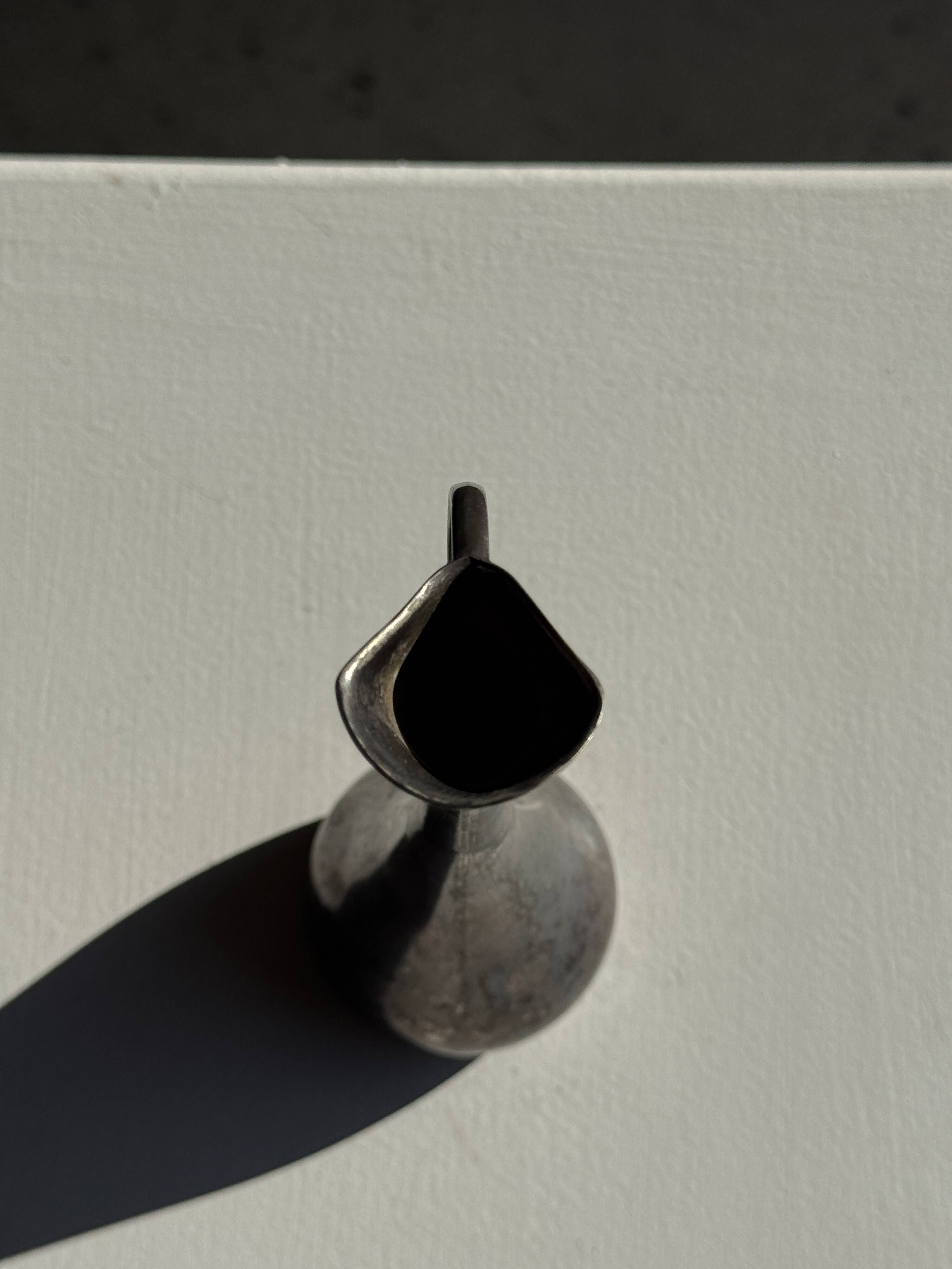 Vintage silver-plated soliflore vase with a dark patina in the shape of a ewer.