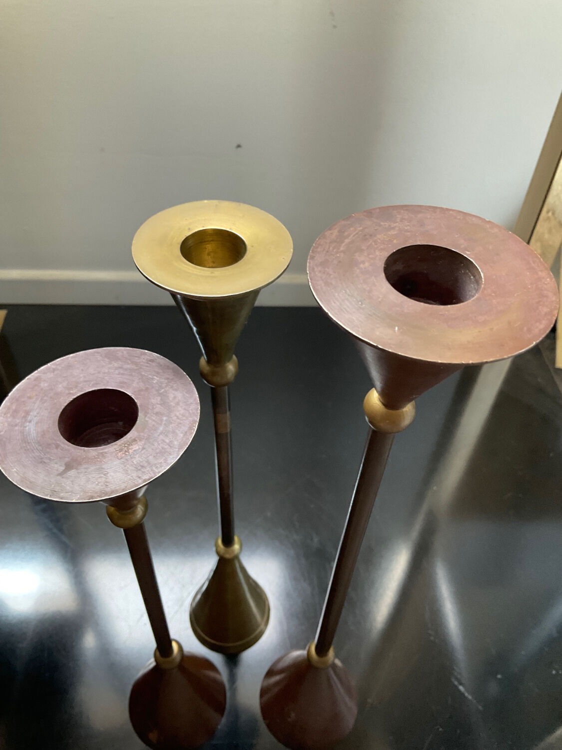 Trio of vintage brass and copper candle holders