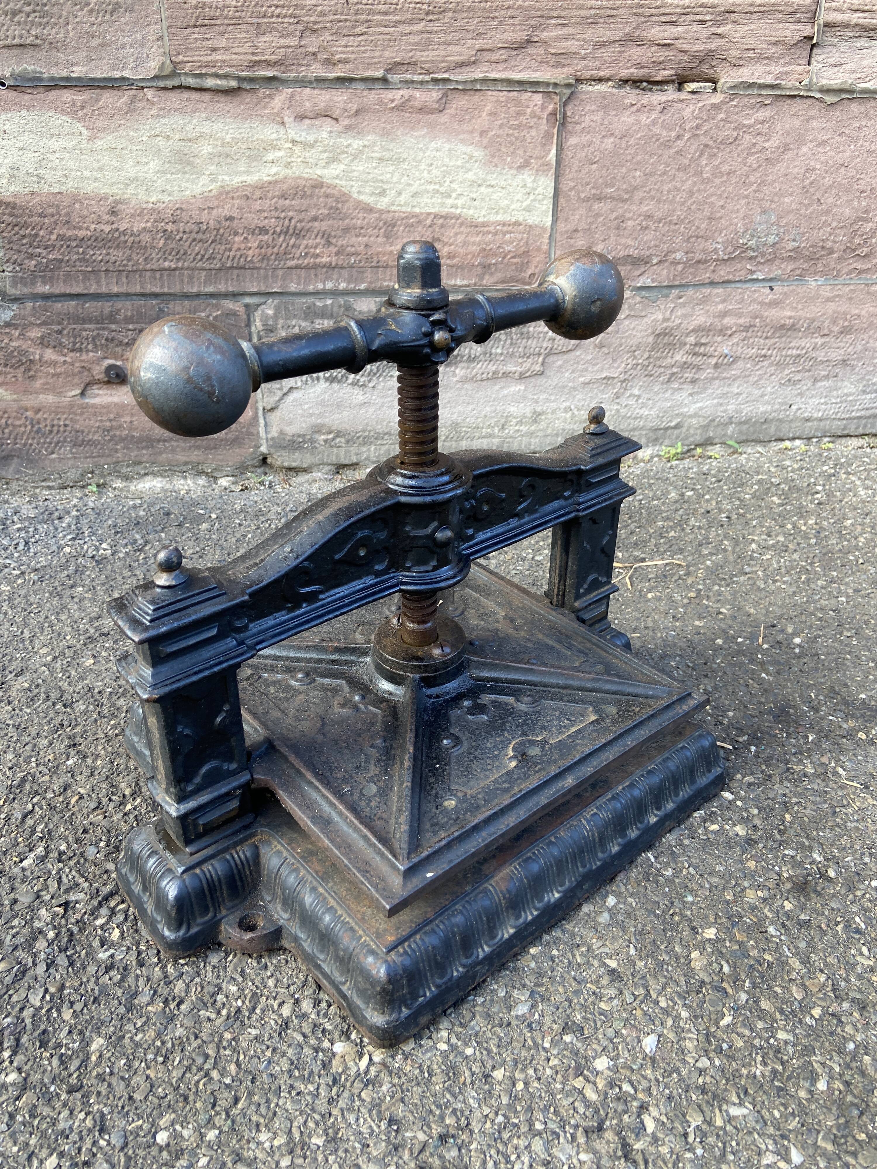 Old printing press in very old cast iron