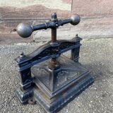 Old printing press in very old cast iron