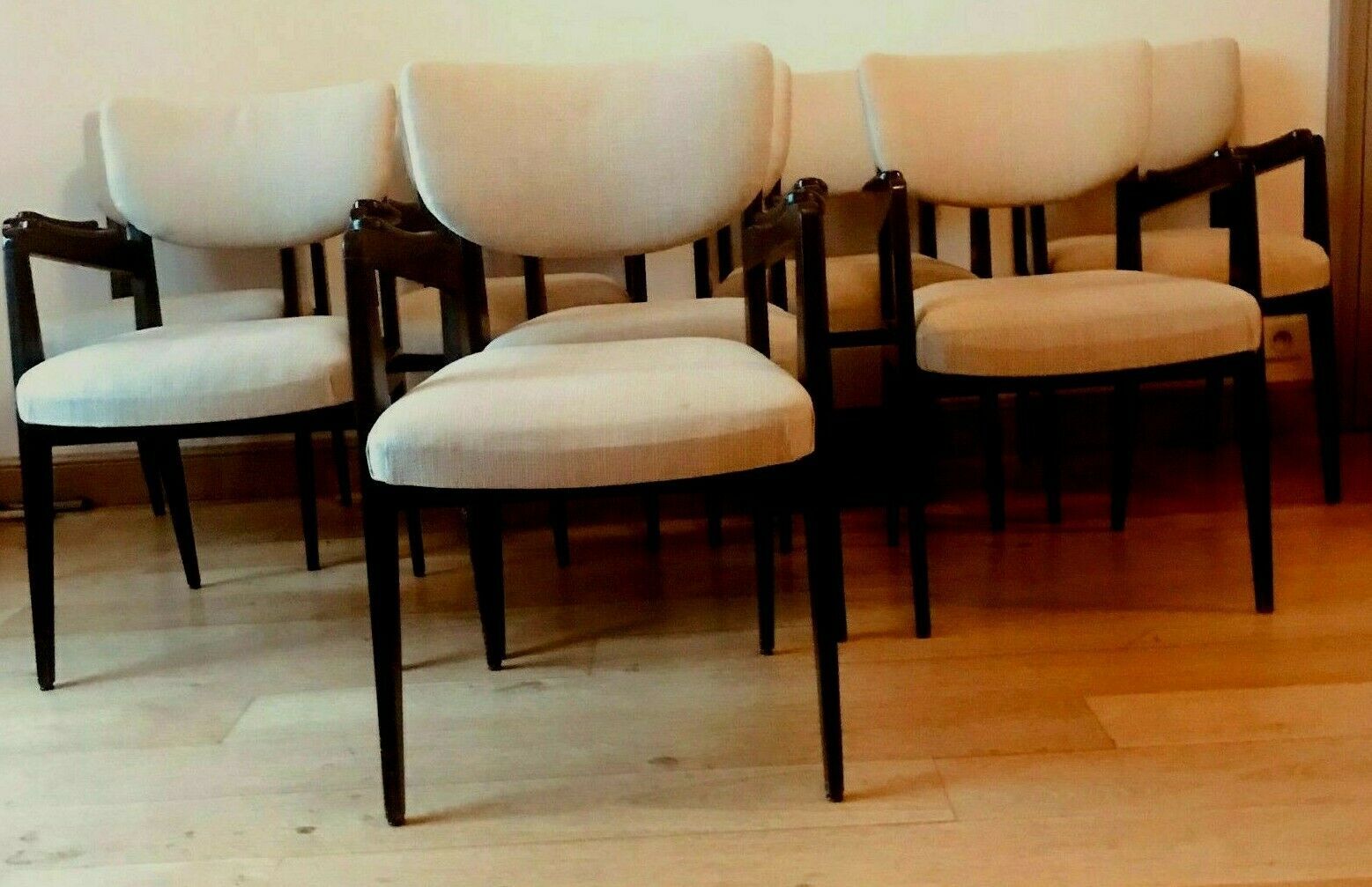 Suite of eight design chairs from the 60s in 10th century blackened wood
