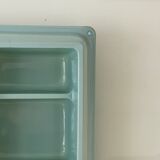 Baby blue plastic mirror and wash station