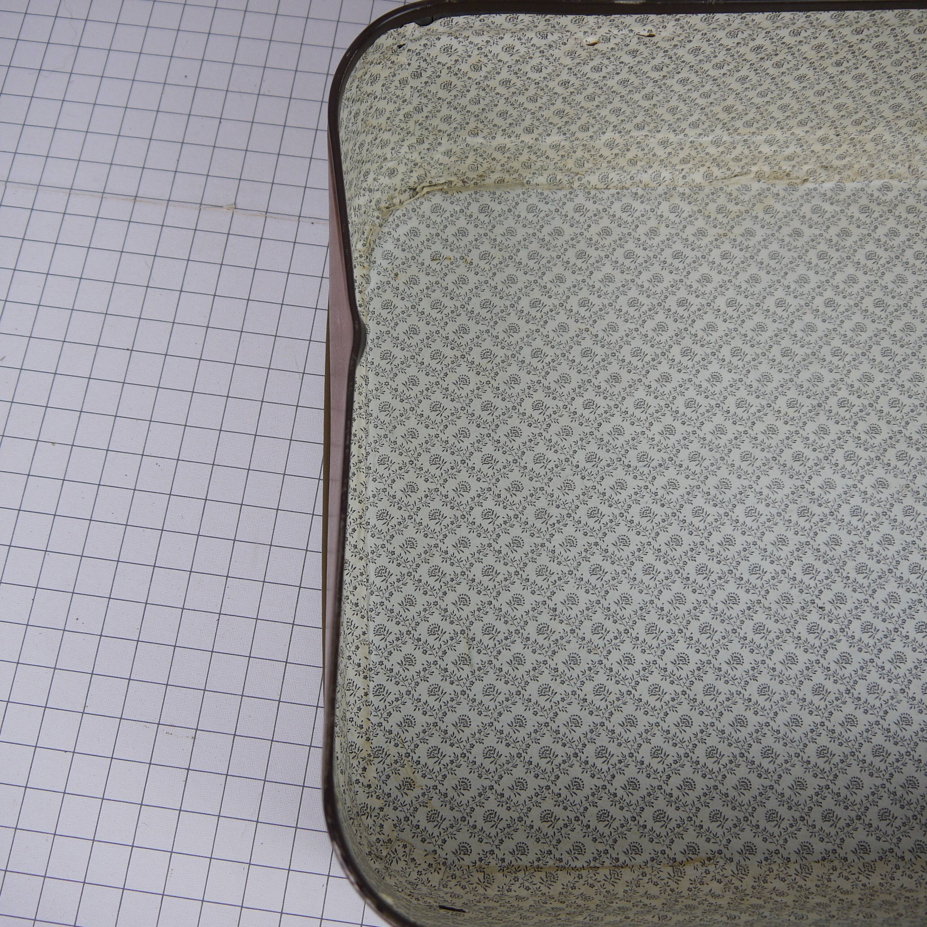 Cardboard and brown leather case