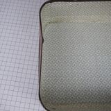 Cardboard and brown leather case