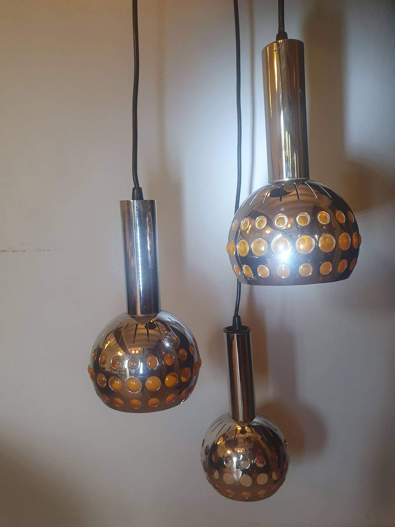 Raak three-light space age orange pendant lamp, 1970s, Netherlands