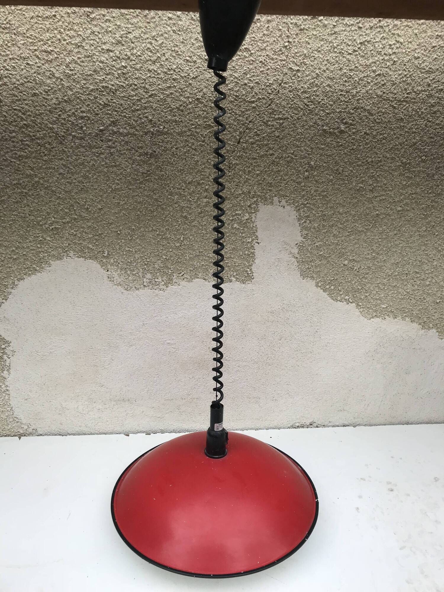 Old red metal suspension lamp from the 70s