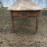 Antique farmhouse table in solid oak with tapered legs and 1 drawer at the end.