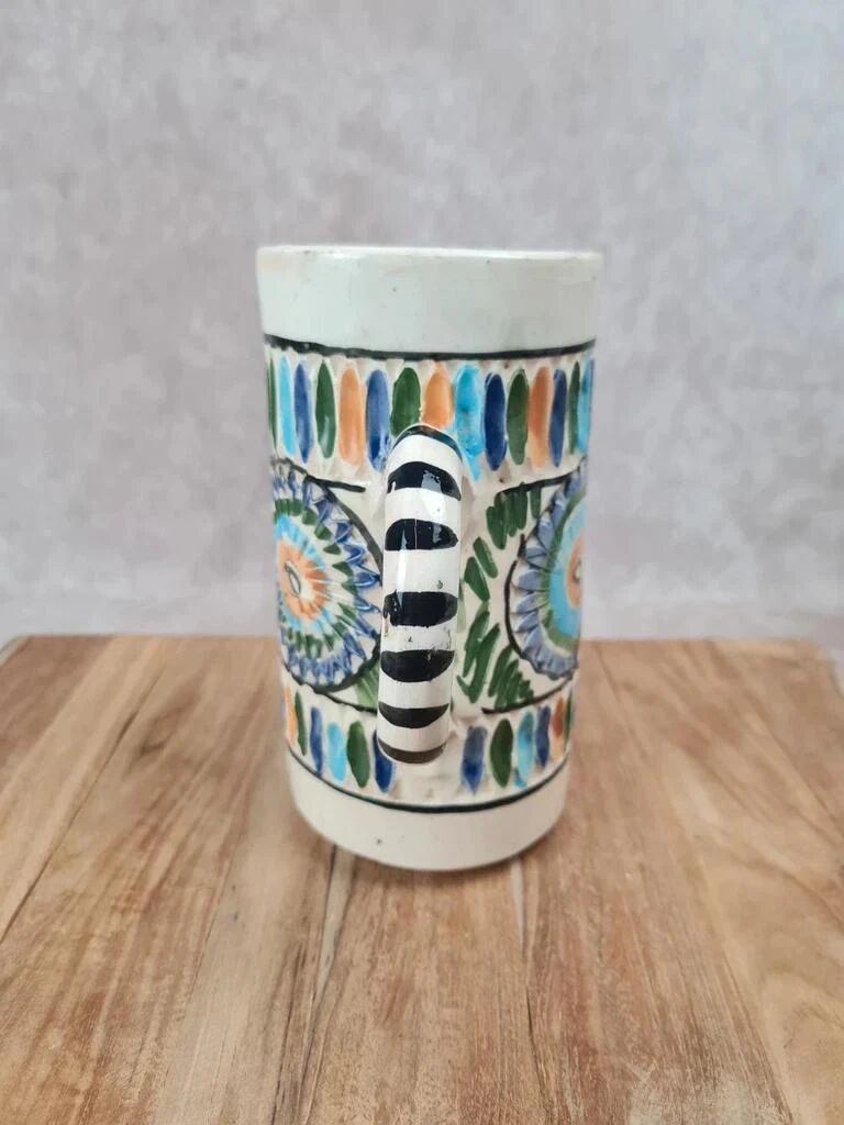 Old pitcher in Tunisian earthenware with colourful decoration.