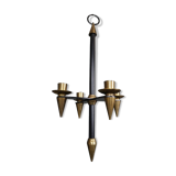 Candle holder in black metal and brass