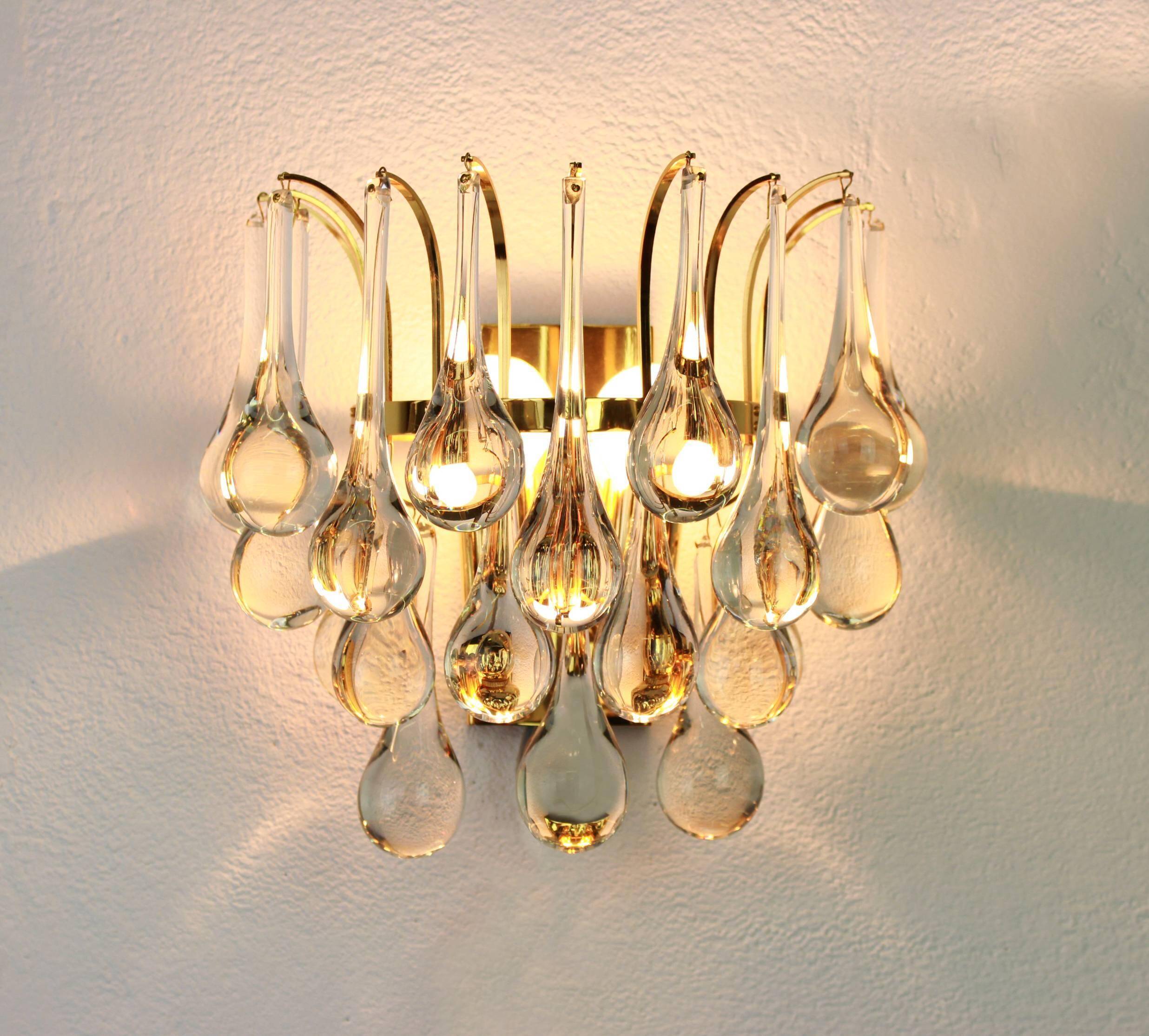 Large pair of gilt brass and crystal wall lights by Palwa, Germany, 1970s.