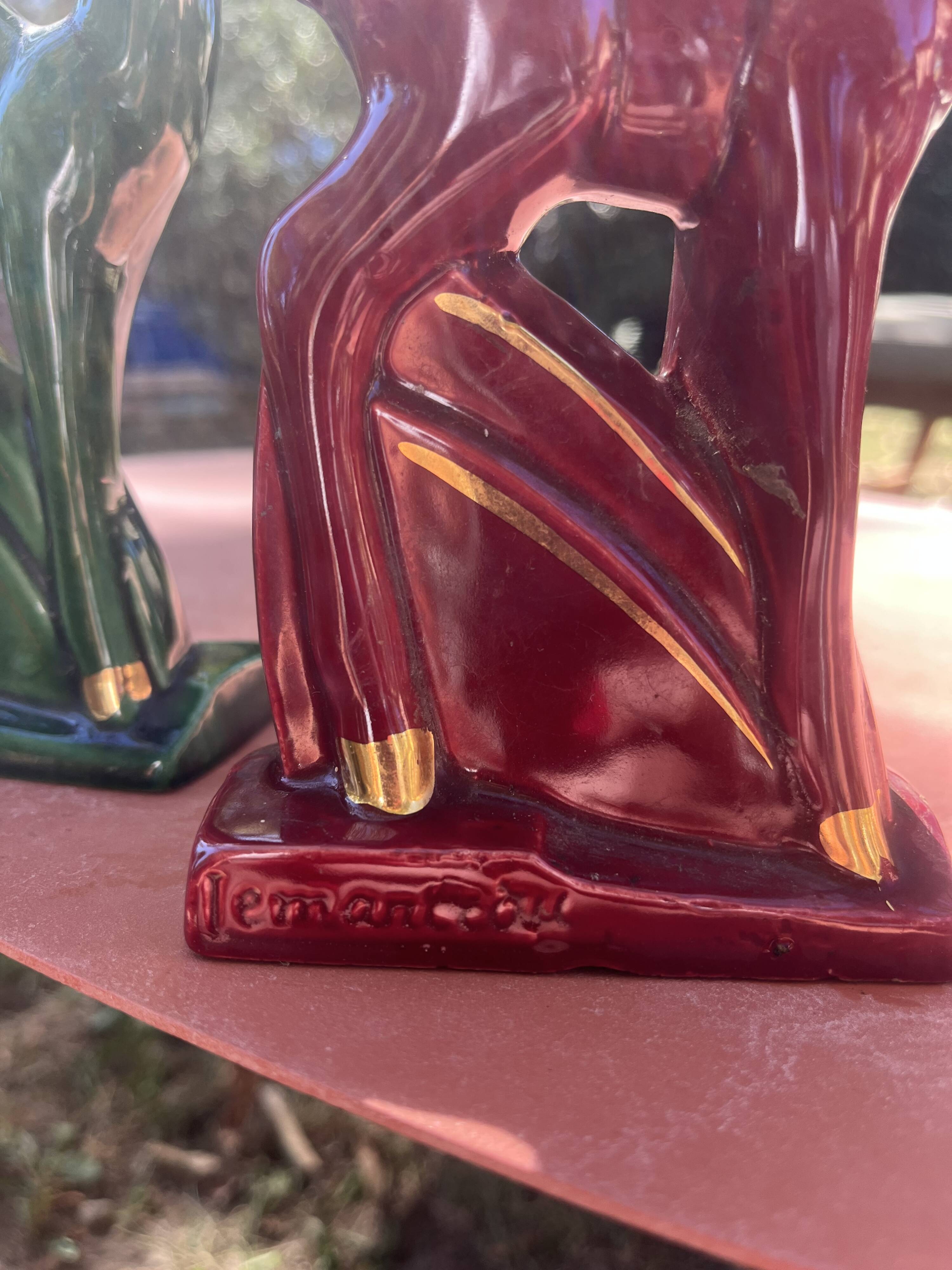 Pair of Art Deco deer by Charles Lemanceau in red and green ceramic.