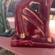 Pair of Art Deco deer by Charles Lemanceau in red and green ceramic.