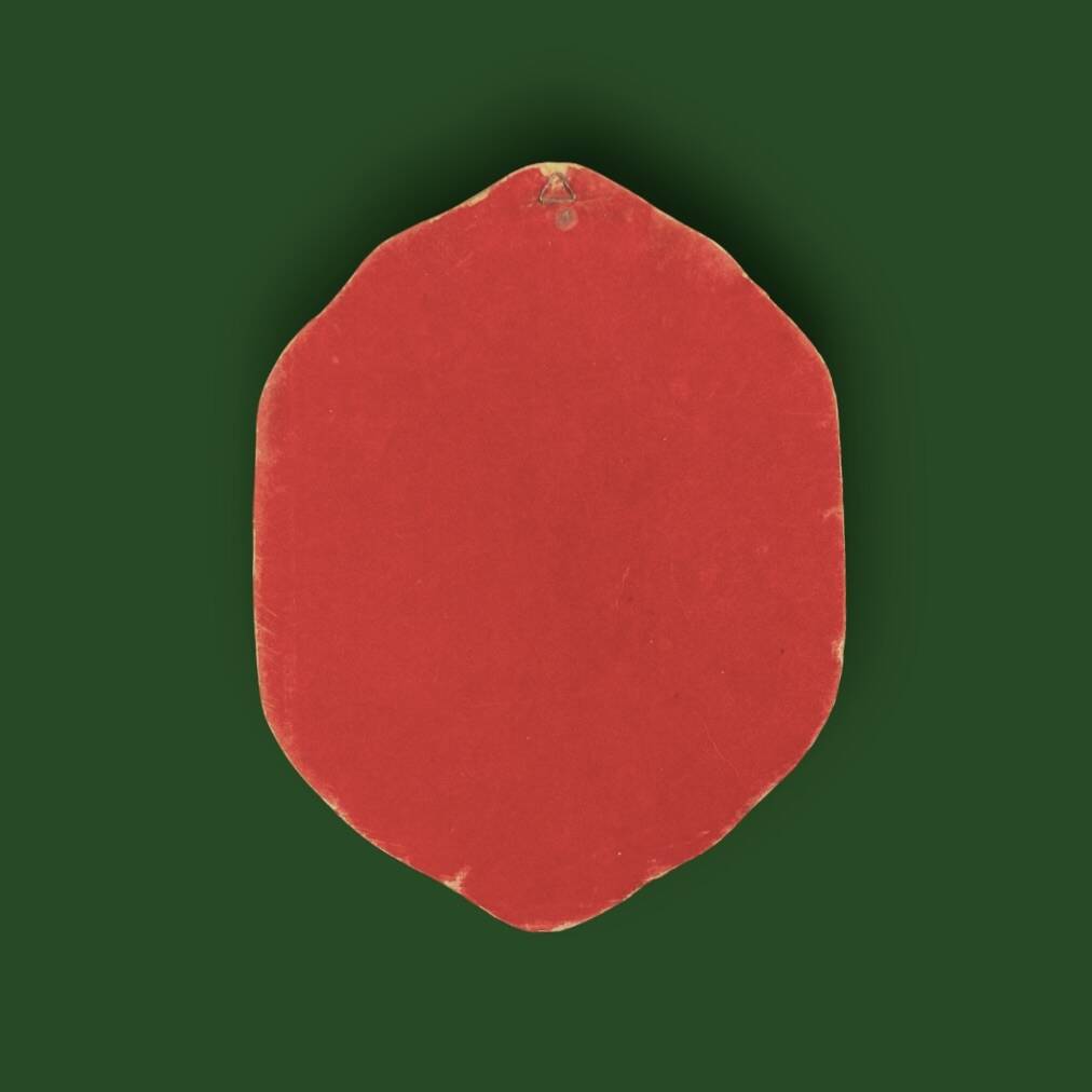 Oval wall mirror in burgundy velvet and brass – 1950s–1960s