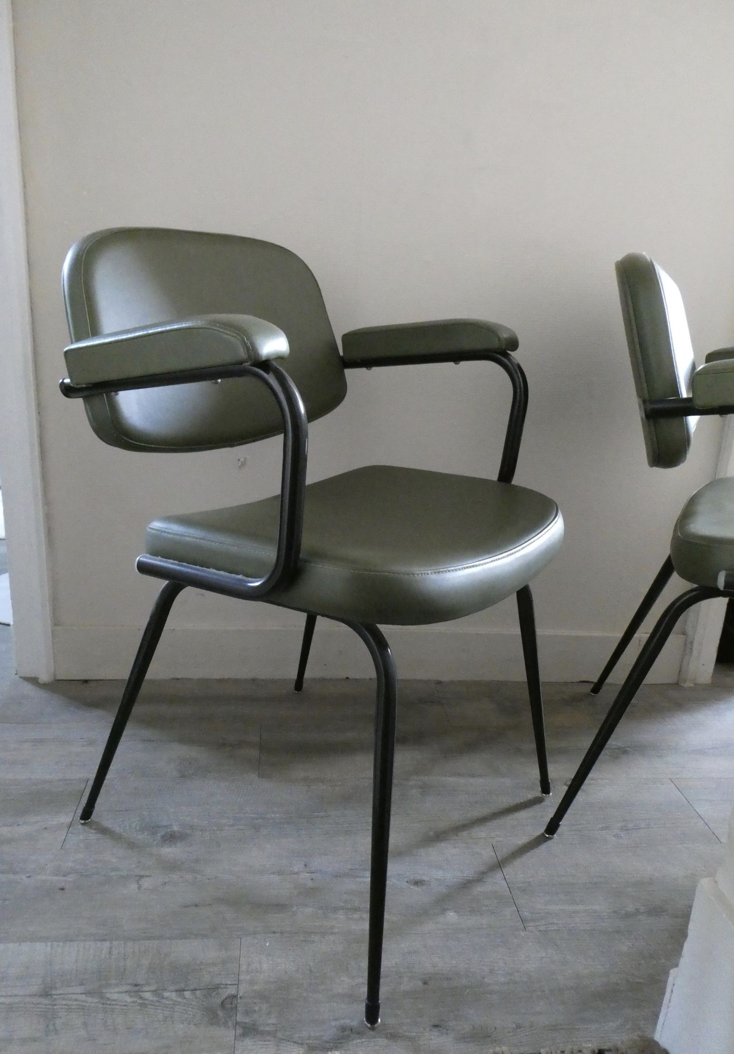 Pair of khaki green metal and skai armchairs from the 1960s