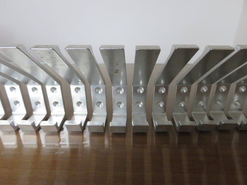 Series of 16 70s aluminium pads
