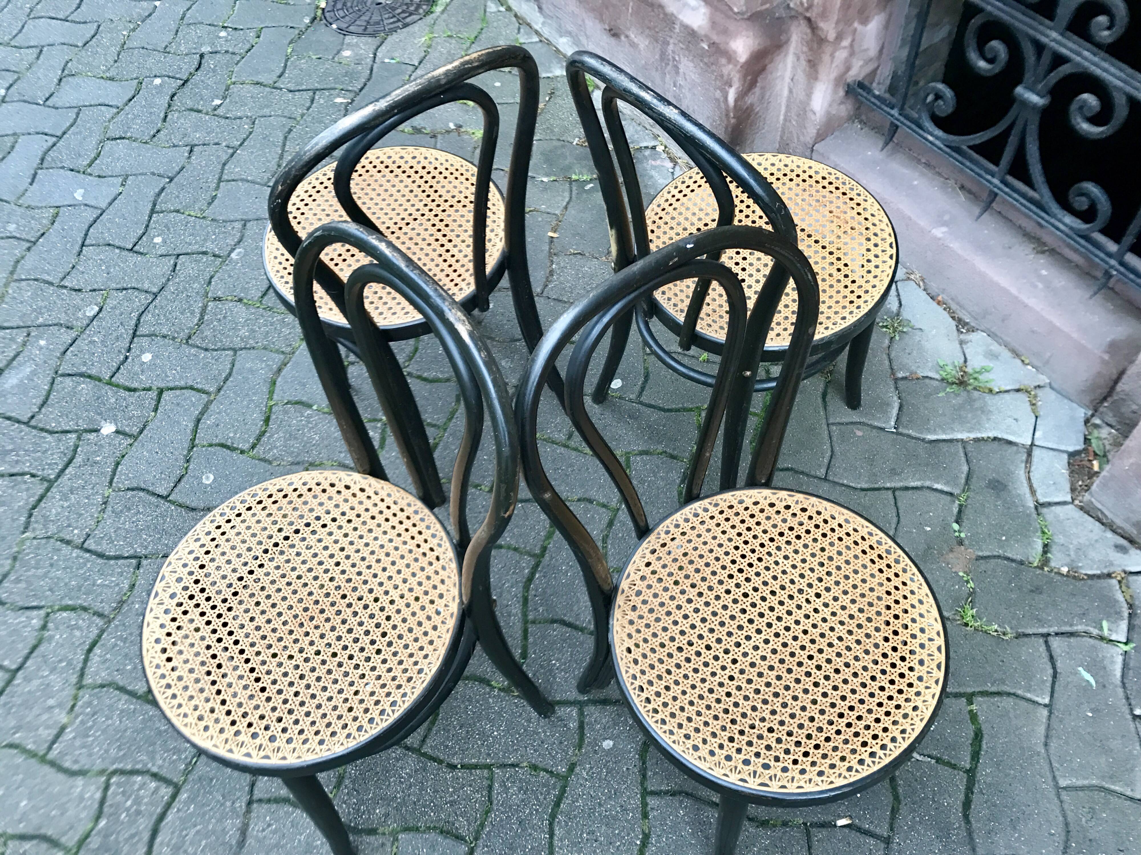 Two pairs of black 50s chairs - number 18 - cannée