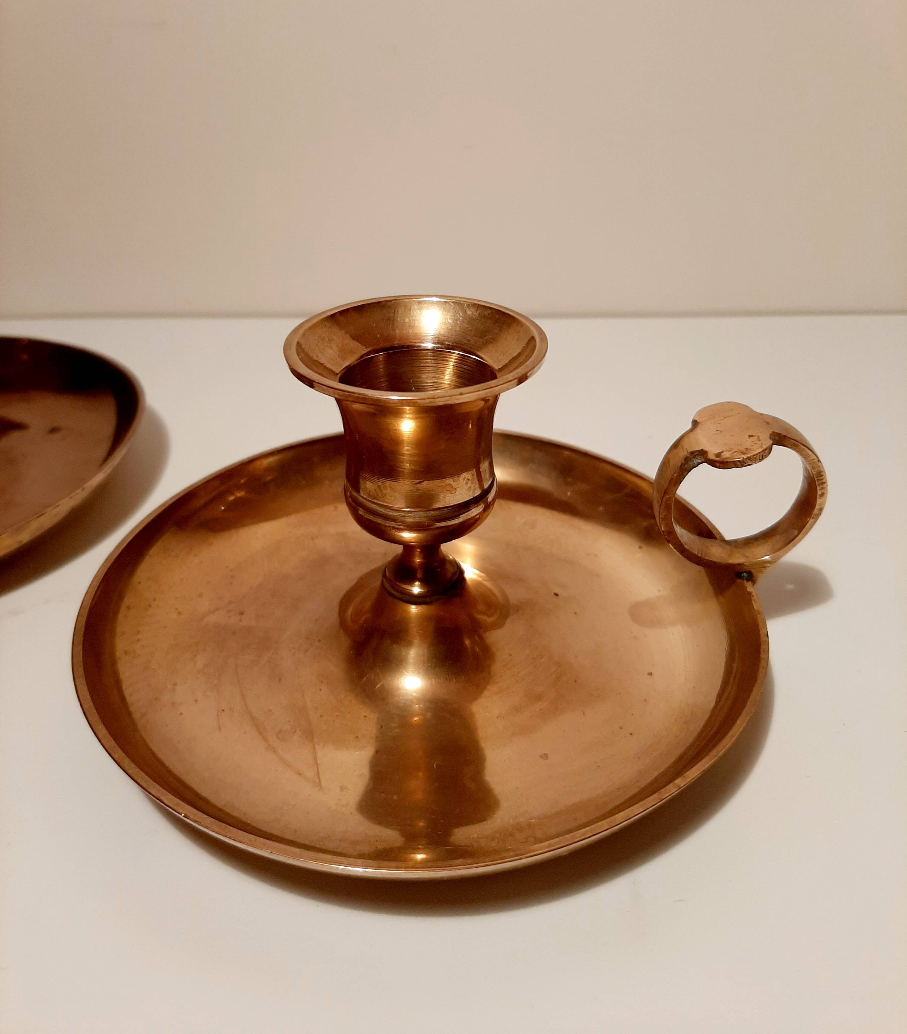 Pair of brass hand candlesticks