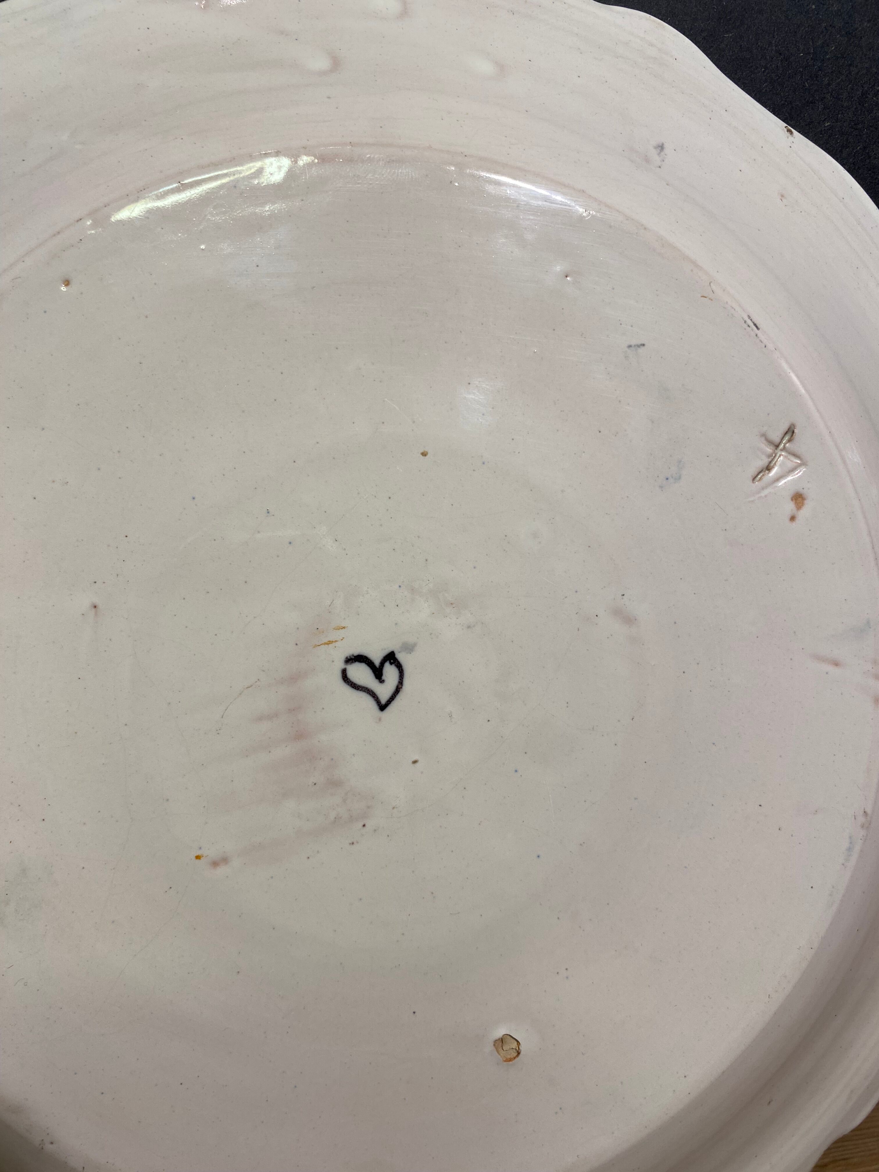 Faience dish of eighteenth-century style nevers decorated with basket with bunches of grapes