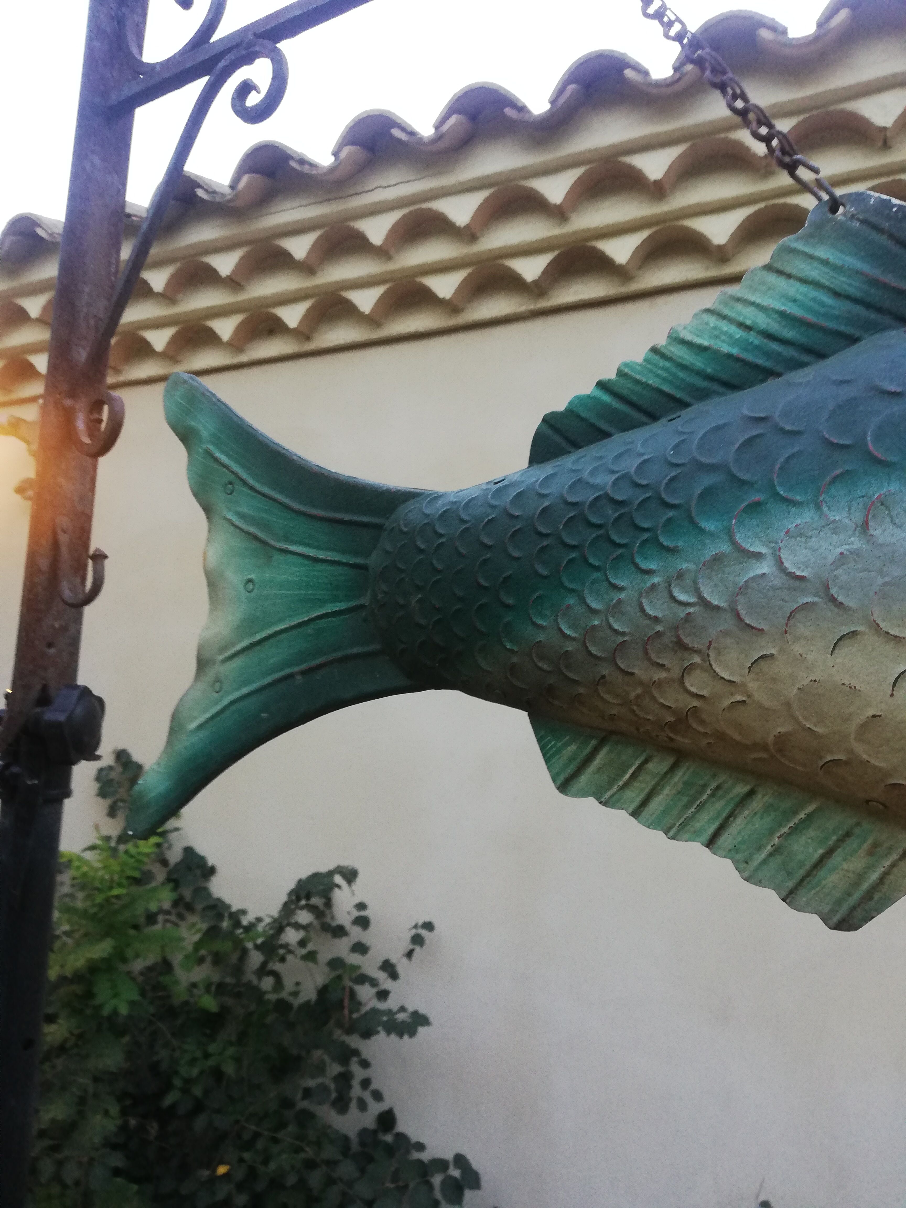 Panel depicting a fish in sheet metal