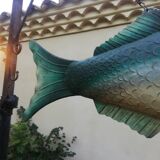 Panel depicting a fish in sheet metal