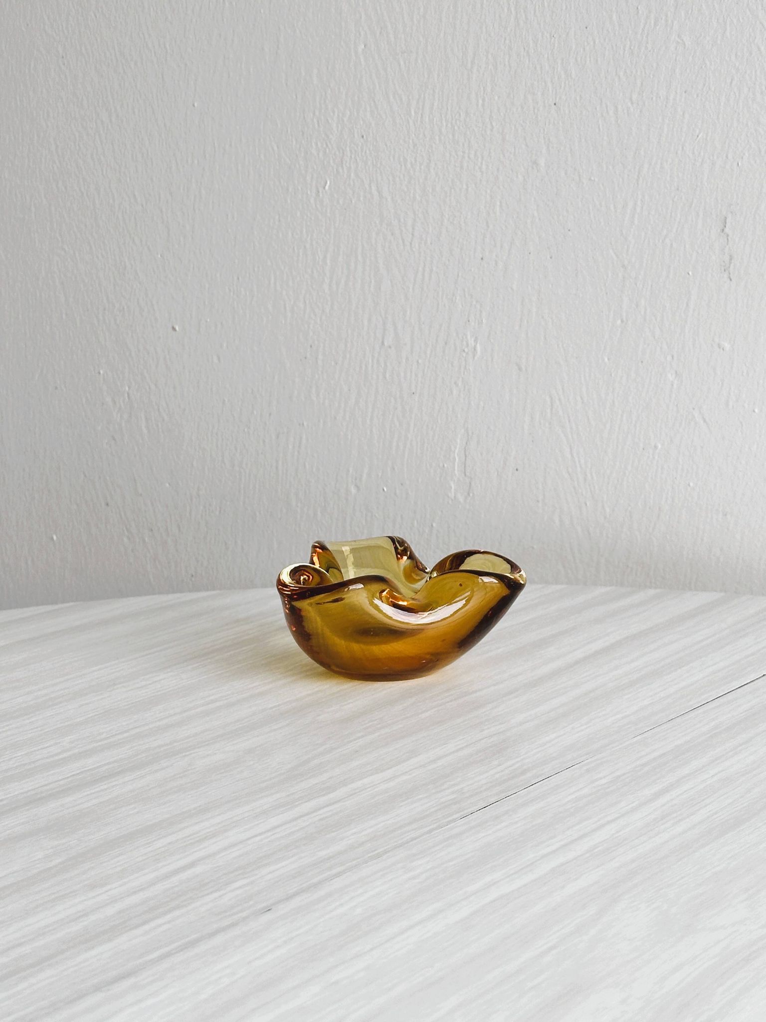 Thick amber yellow glass ashtray