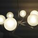 Six-light chrome metal chandelier and opaque glass globes / vintage 60s and 70s