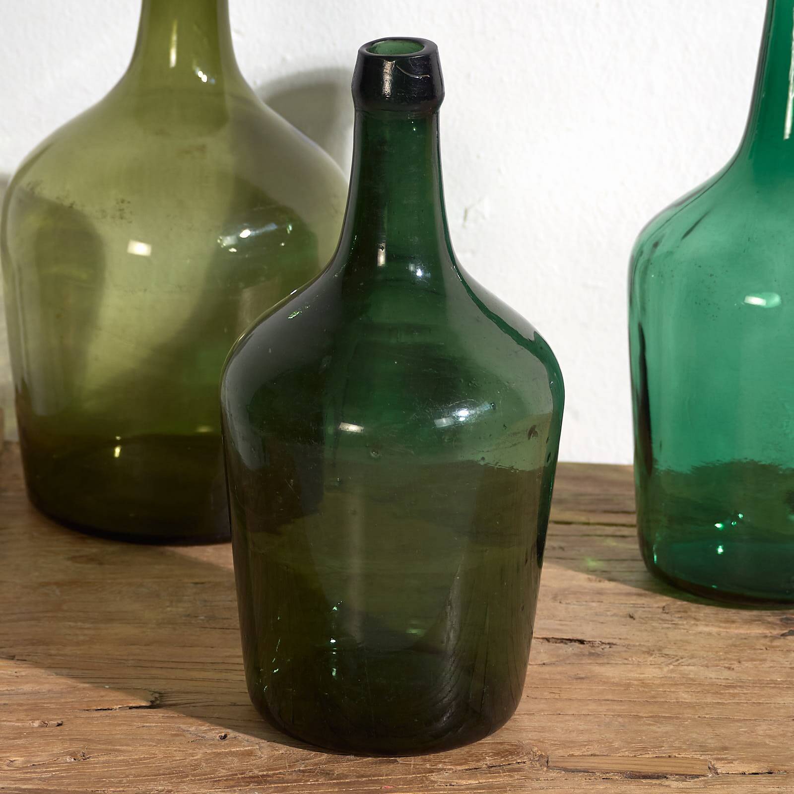 Antique green demijohns (c.1920). Set of 3 pieces