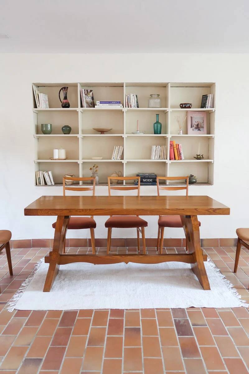 Solid wood dining table, sculpted brutalist base, 1960s.