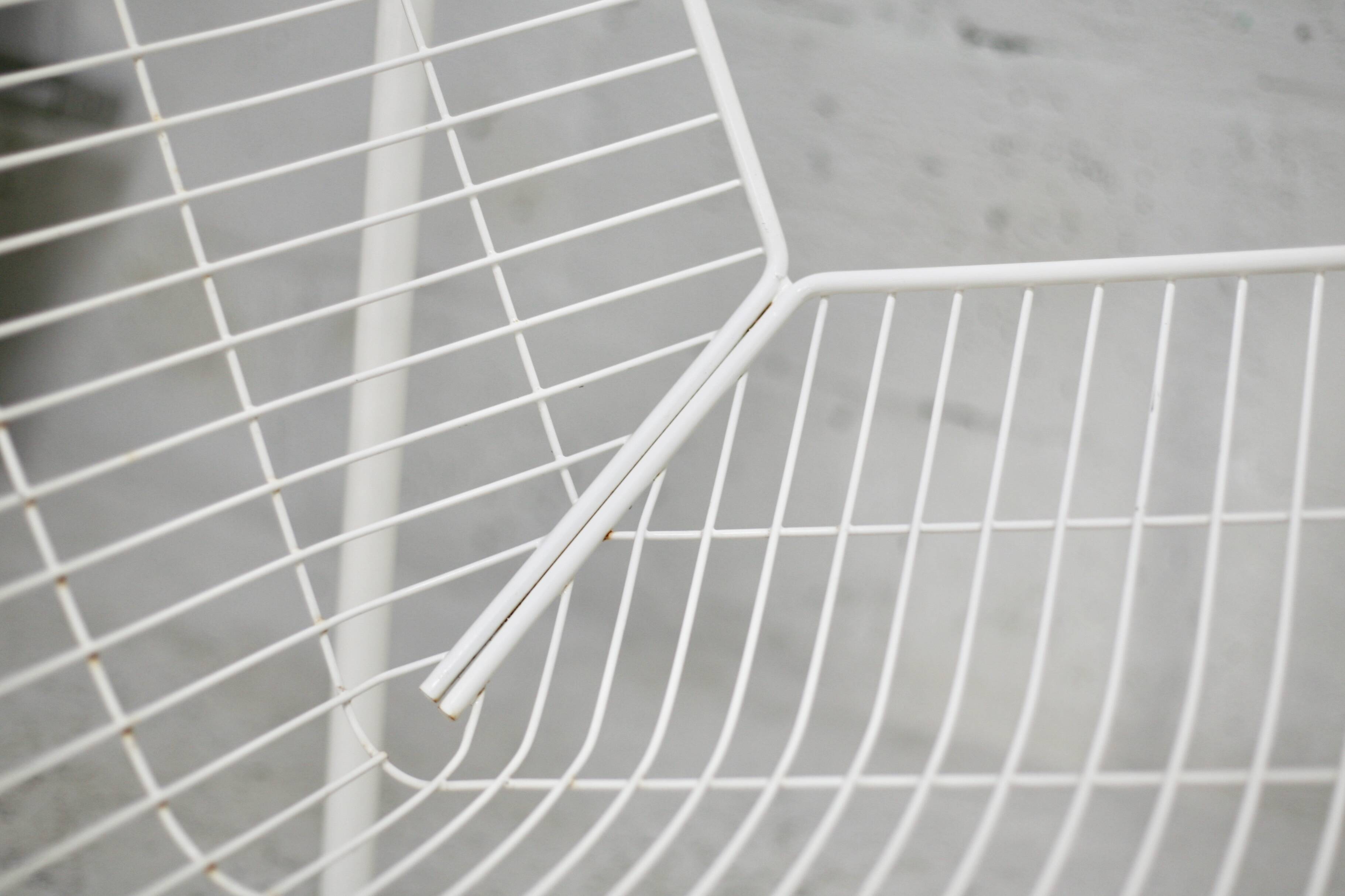 Pair of white lacquered steel rod armchairs. Circa 1985