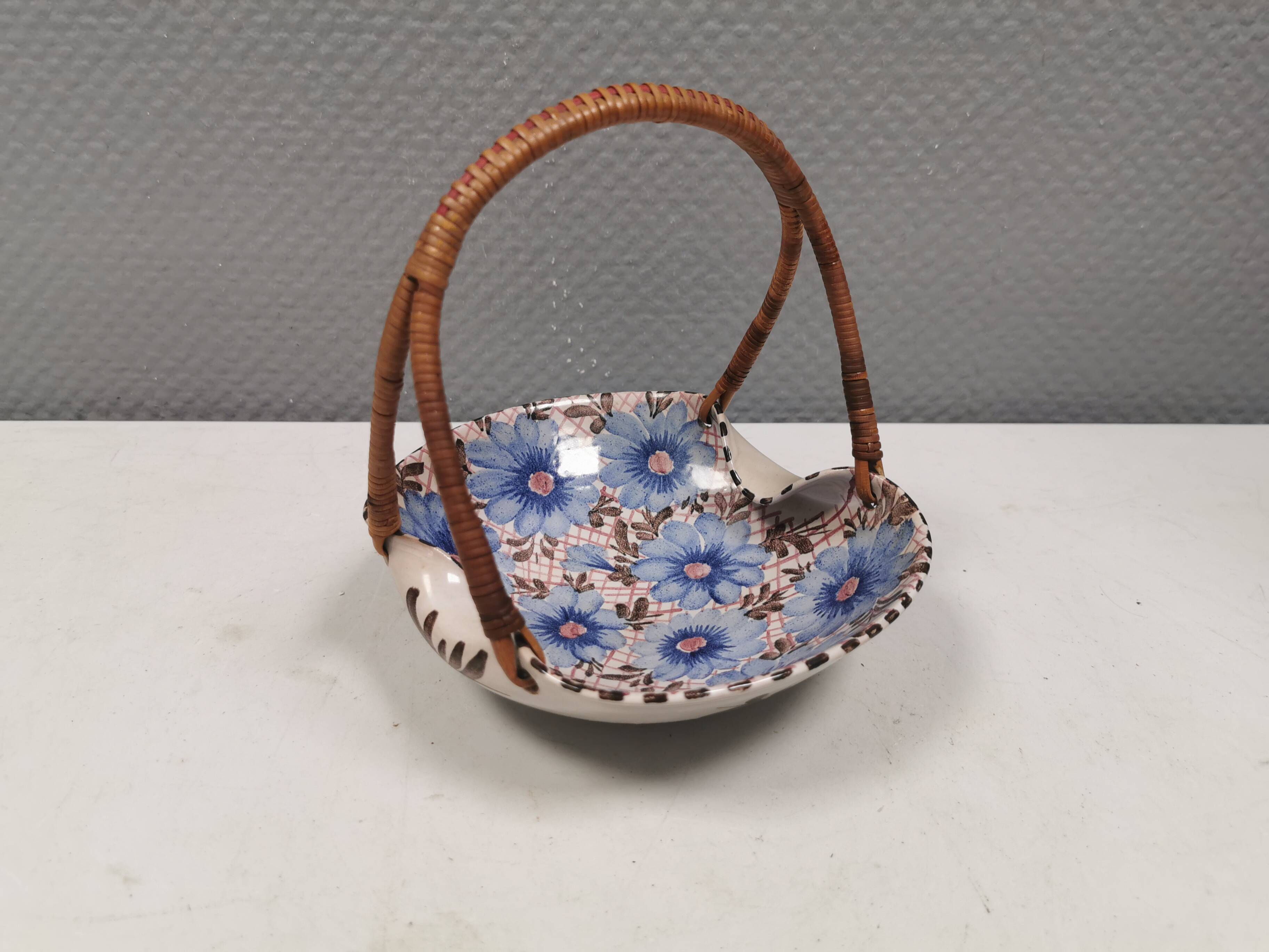 Beautiful small painted ceramic basket with woven handle