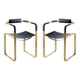 Pair of Wanderlust armchairs with navy blue backrest and brass.