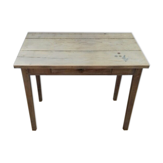 Small old wooden table with inclusion of coins and keys