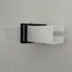 Simple white plexiglass wall light with a black metal frame, 1970s, Germany.