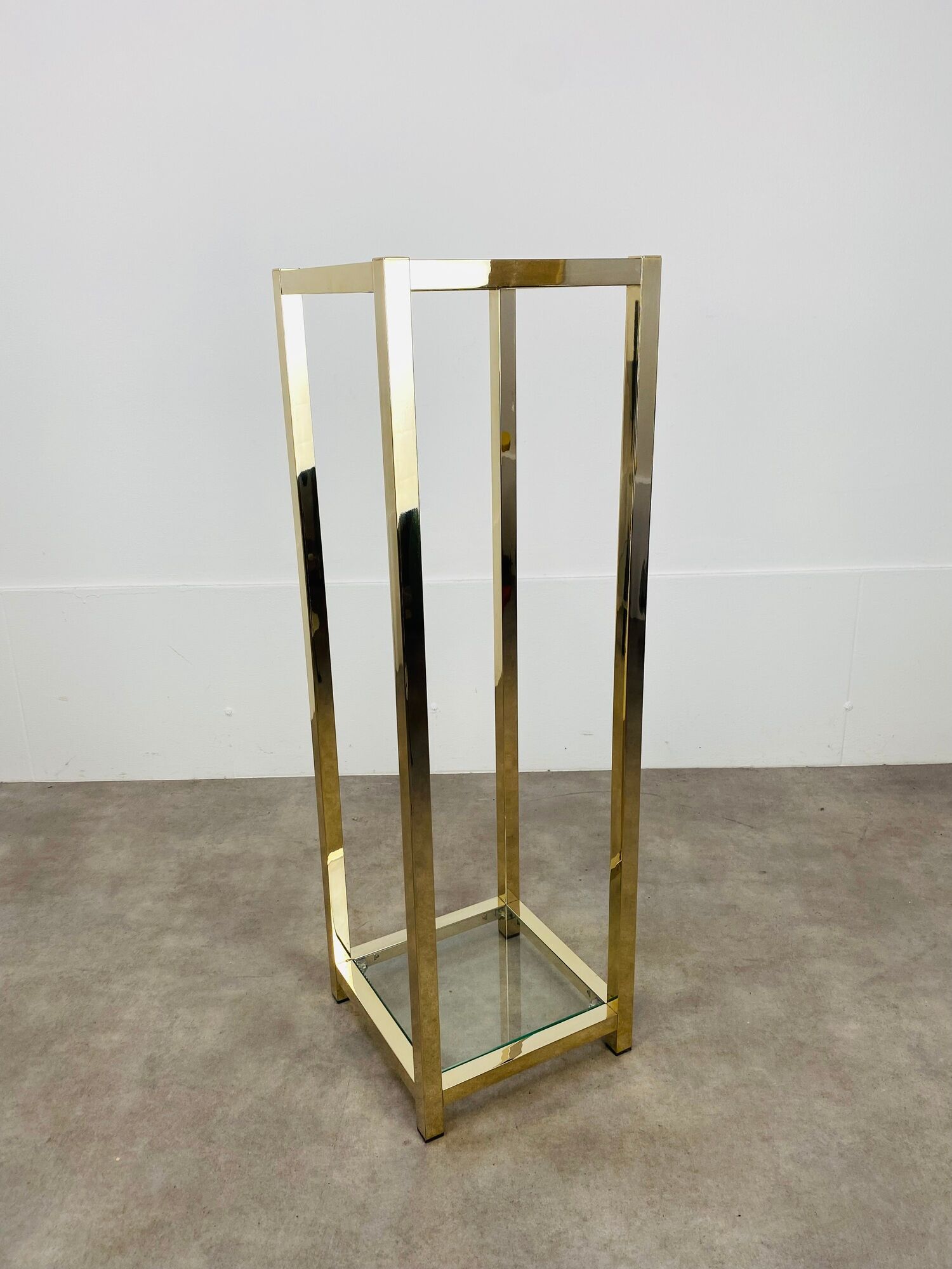 Gilded metal fifth wheel column and Hollywood Regency style glass 70s