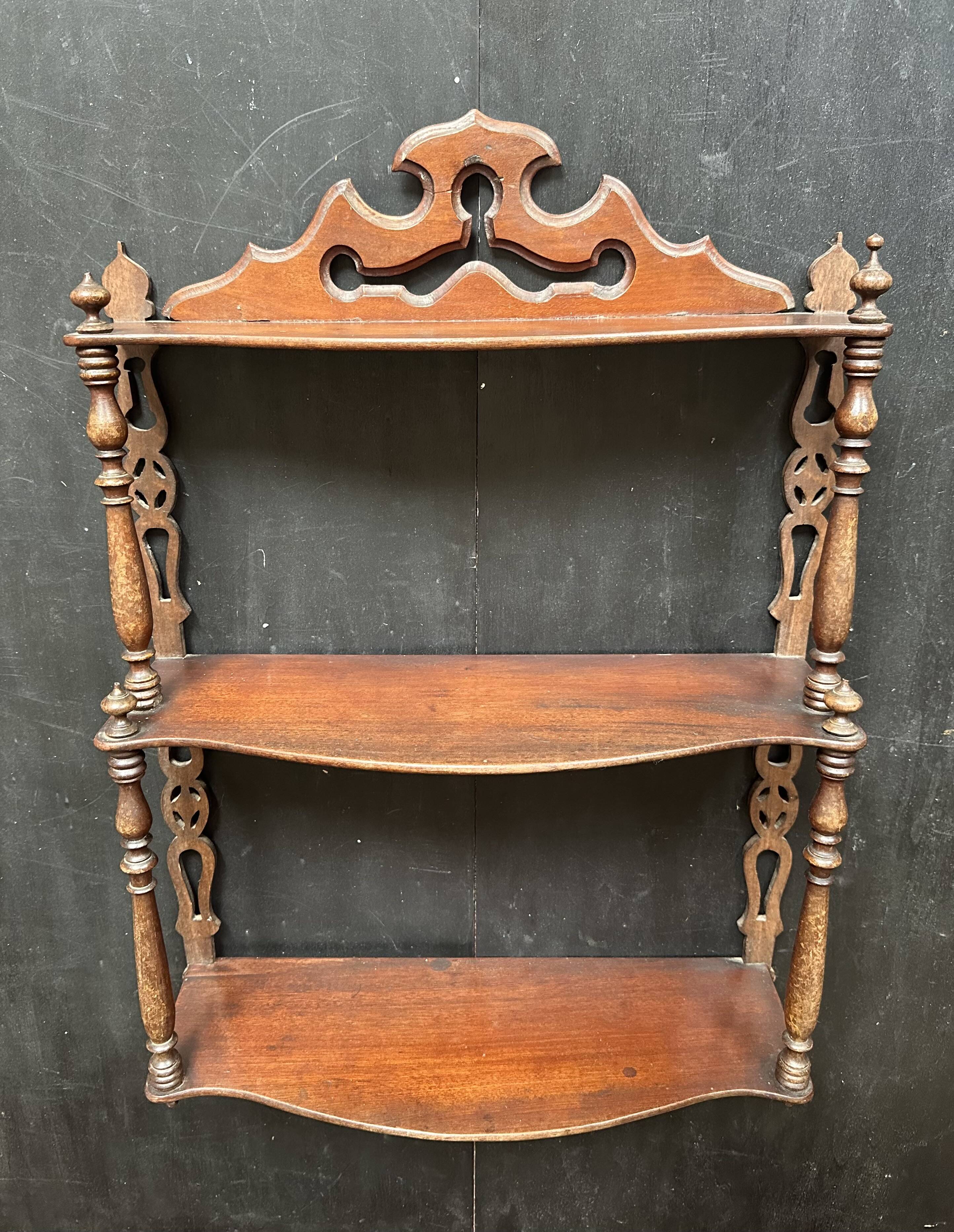 Napoleon III wall shelf in turned wood with a pediment.