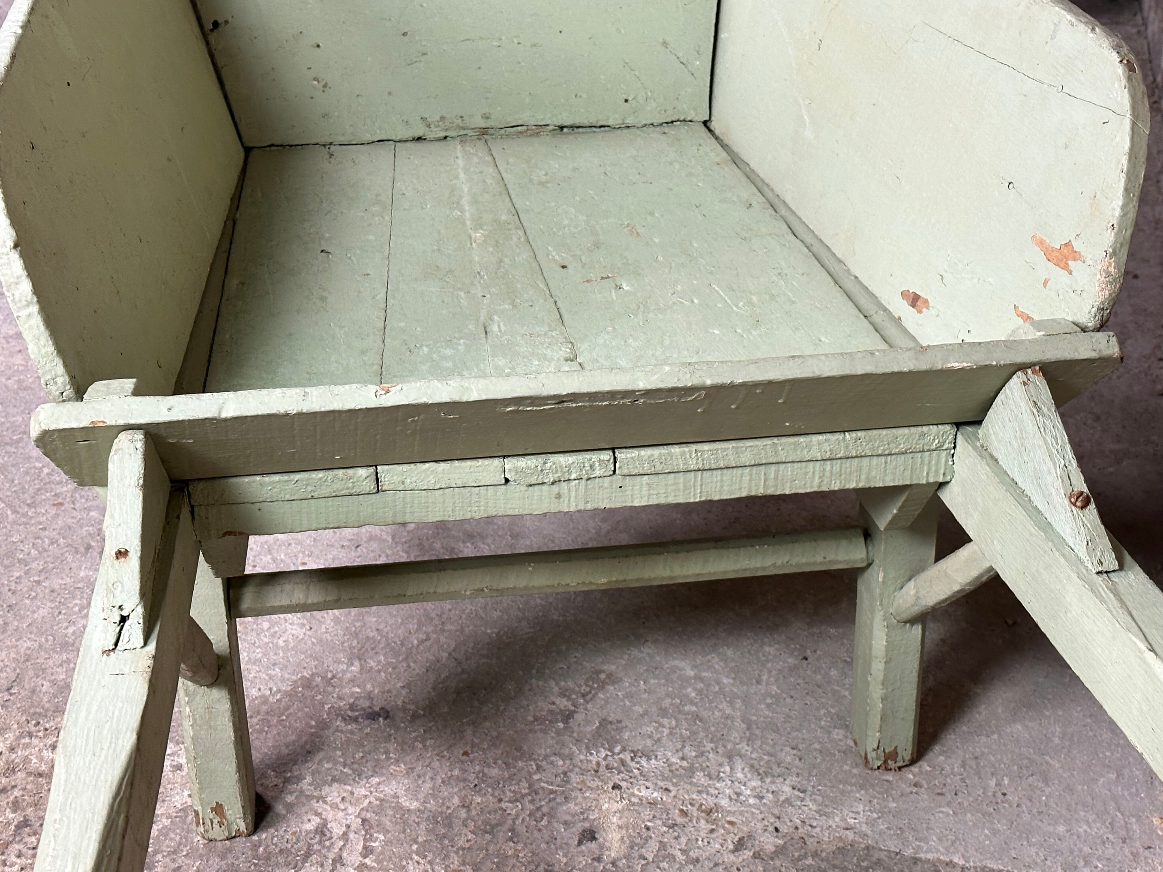 Antique wooden wheelbarrow