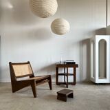 Reclined armchair in canned teak in natural wood