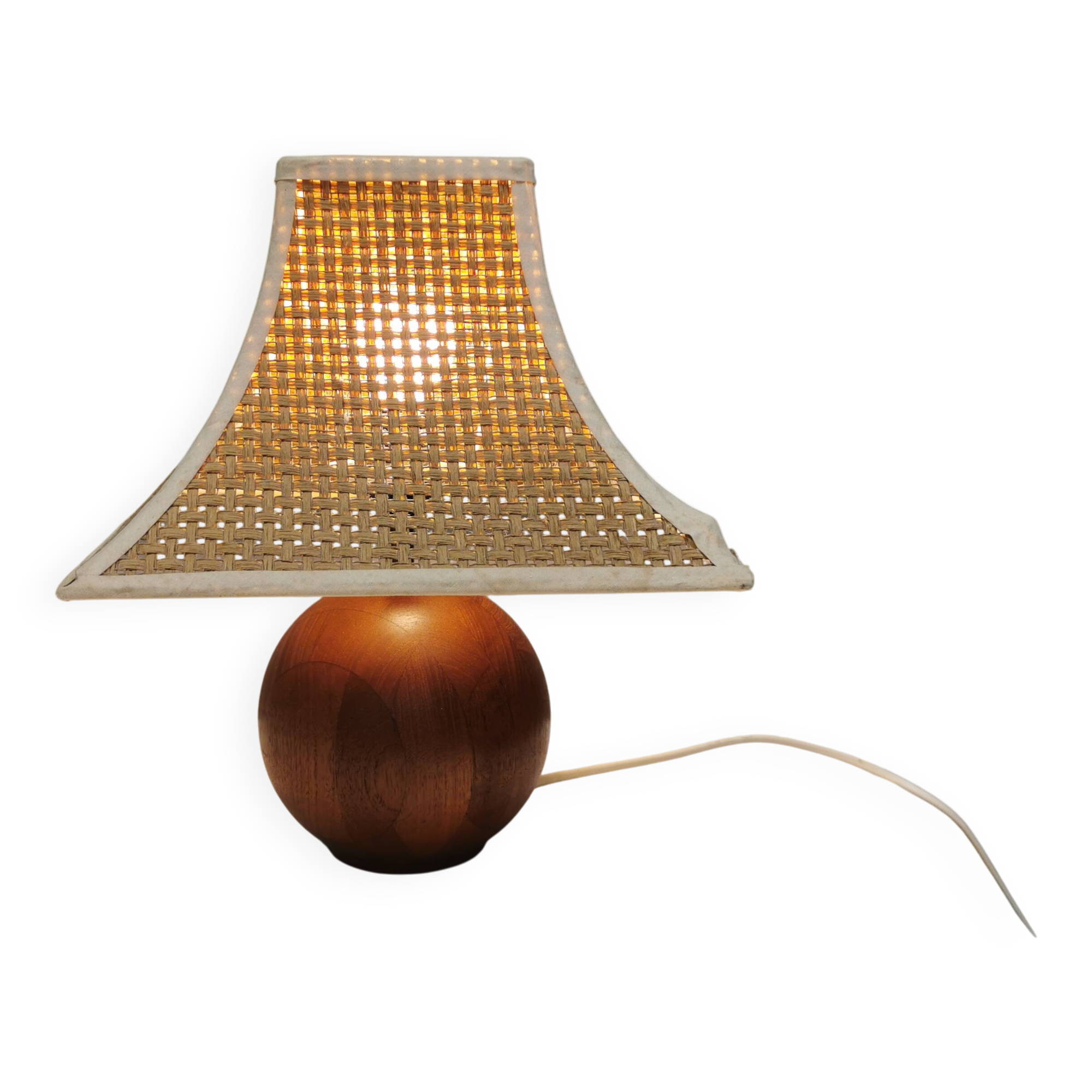 Very rare table lamp in turned teak wood with original braided shade. 1970s