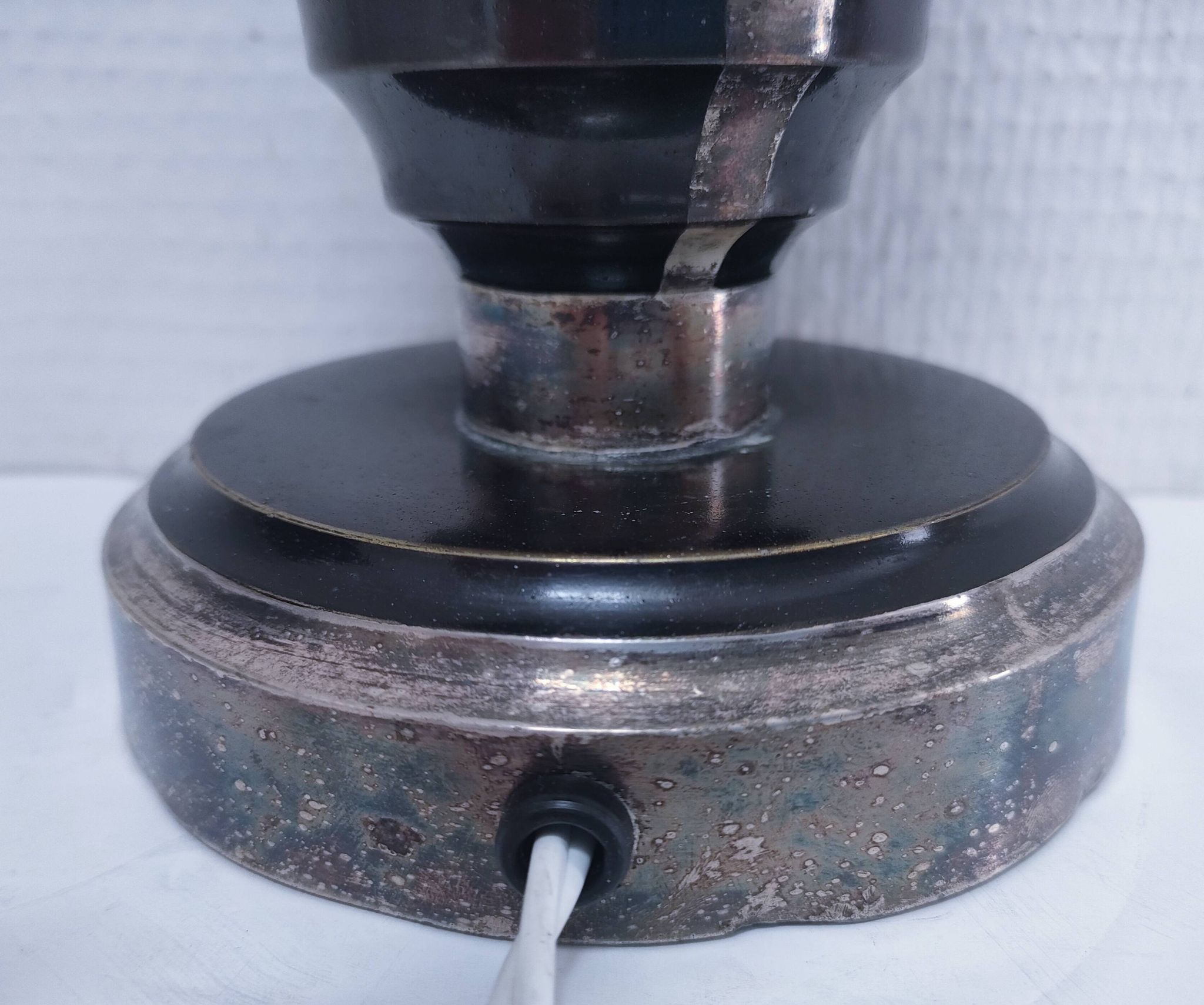 Art Deco metal lamp base with black and silver patina